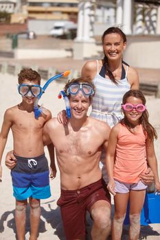 Summers here. a family at the beach with their snorkeling gear
