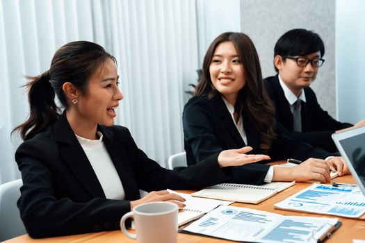 Business team of financial data analysis meeting with business intelligence, report paper and dashboard on laptop for marketing strategy. Business people working together to promote harmony in office.
