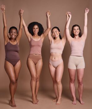 Women diversity, body positivity and skin color celebration of group of model friends holding hands. Skincare beauty, trust and woman community support portrait together with global care and love.
