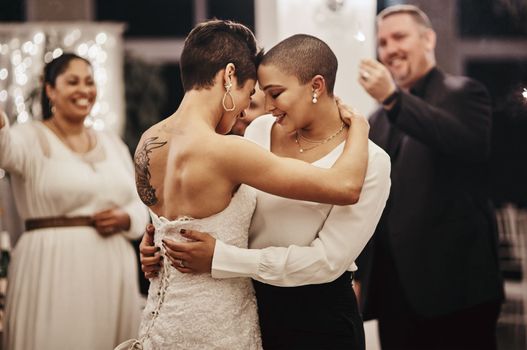 Wedding, love and dance with a lesbian couple in celebration of their union together at a ceremony of tradition. LGBT, woman or diversity with a female and partner dancing after being married.