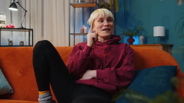 Eureka. Thoughtful clever inspired woman with short blonde hair make gesture raises finger came up with creative plan feels excited with good idea, inspiration motivation at home. Excited amazed girl