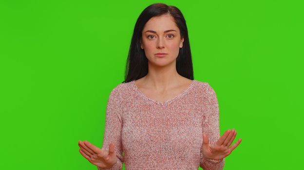 Hey you, be careful. Young woman warning with admonishing finger gesture, saying no, be careful, scolding and giving advice to avoid danger, disapproval sign. Girl isolated on chroma key background