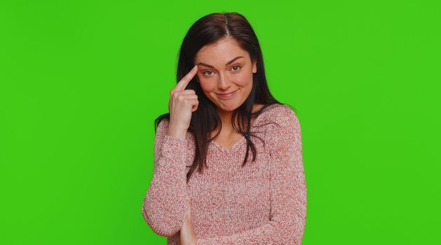 You are crazy, out of mind. Pretty young woman pointing at camera and showing stupid gesture blaming some idiot for insane plan, bullying. Millennial confused girl isolated on chroma key background