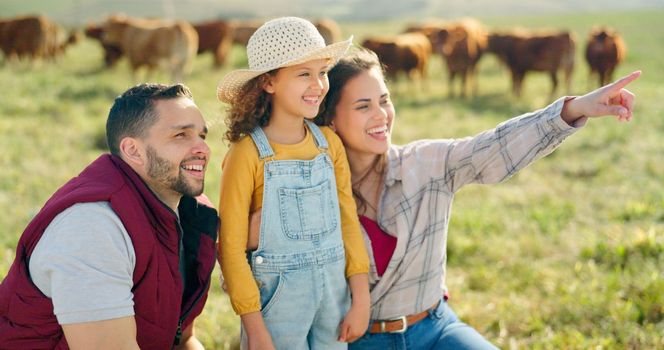 Happy family bonding on a cattle farm, happy, laughing and learning about animals in nature. Parents, girl and agriculture with family relaxing, enjoying and exploring the outdoors on an open field.