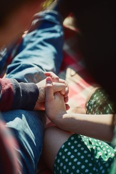 My heart chooses you over and over again. an affectionate couple holding hands outdoors