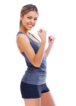 Theres nothing better than reaching your goal. Studio portrait of an attractive woman wearing sports clothing looking enthusiastically happy