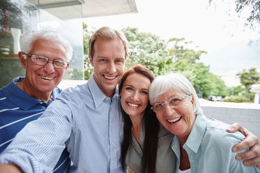 Family selfie. four adults taking a family selfie