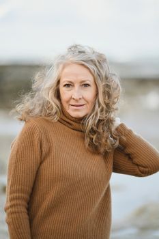 Portrait of a fifty-year-old woman with a grey hair