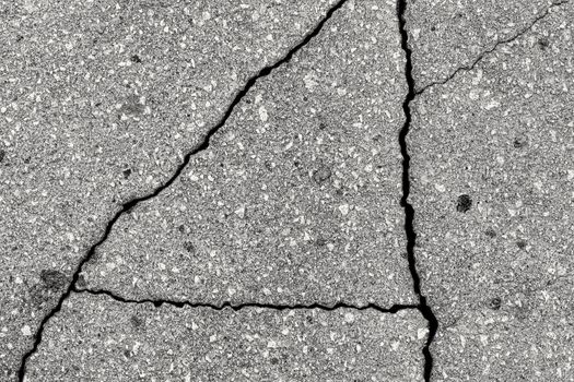 Cracked texture of gray asphalt. Abstract background for design.