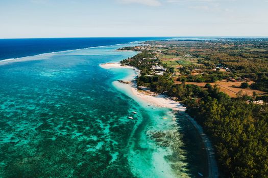 Aerial photography of the East coast of the island of Mauritius. Flying over the turquoise lagoon of Mauritius in the Belle Mare area.Coral reef of Mauritius. Mauritius Island Beach.