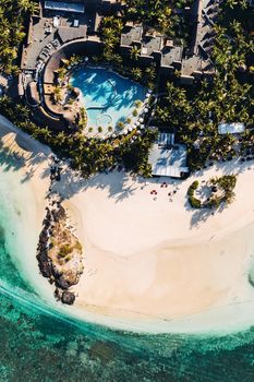 Aerial picture of the east coast of Mauritius Island. Flying above the turquoise lagoon of Mauritius in the region of Belle Mare