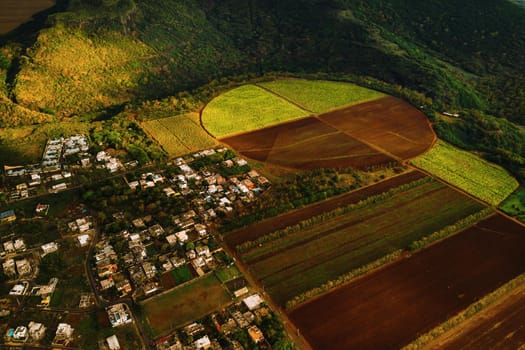 Bird's eye view of beautiful fields Islands of Mauritius and mountains.