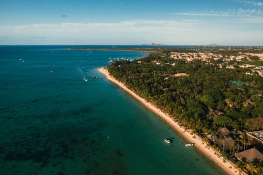 On the beautiful beach of the island of Mauritius along the coast. Shooting from a bird's eye view of the island of Mauritius