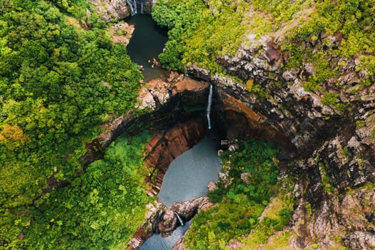 Aerial view from above of the Tamarin waterfall seven cascades in the tropical jungles of the island of Mauritius.