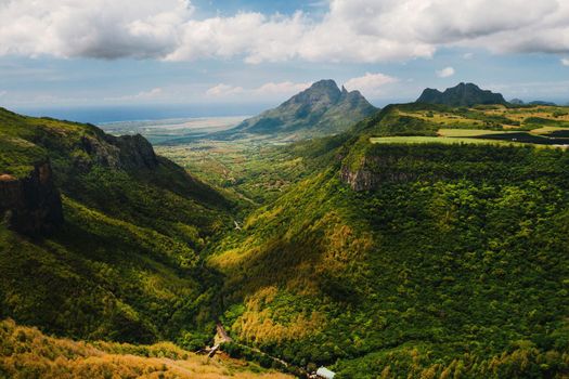 Mountain Landscape of the gorge on the island of Mauritius, Green mountains of the jungle of Mauritius.