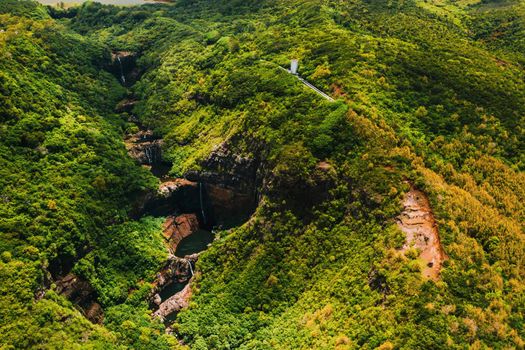 Aerial view from above of the Tamarin waterfall seven cascades in the tropical jungles of the island of Mauritius.