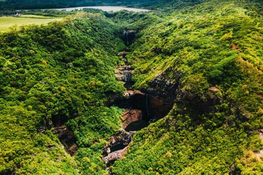 Aerial view from above of the Tamarin waterfall seven cascades in the tropical jungles of the island of Mauritius.