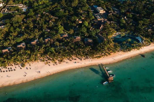 On the beautiful beach of the island of Mauritius along the coast. Shooting from a bird's eye view of the island of Mauritius