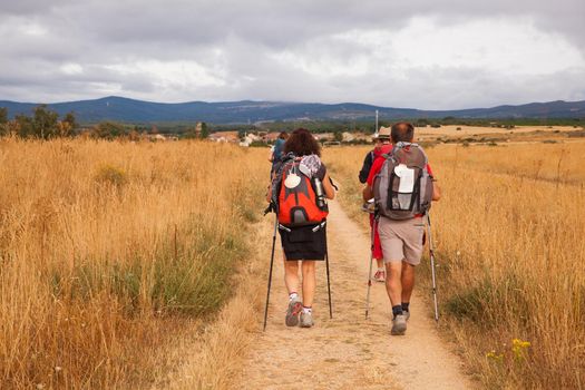ASTORGA COUNTRYSIDE, SPAIN - AUGUST, 04: Pilgrims along the way of St. James on August 03, 2016