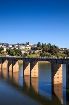 Roman bridge over the Minho River in Portomarin, Spain