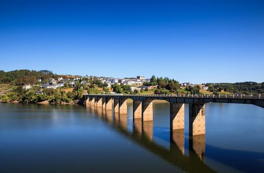 Roman bridge over the Minho River in Portomarin, Spain