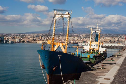 Old fisherboat docked in the Catania pier