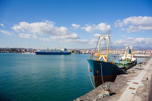 Old fisherboat docked in the Catania pier