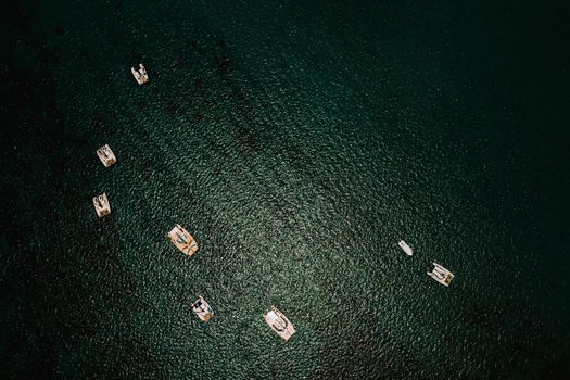 Aerial photography of the East coast of the island of Mauritius. Beautiful lagoon of the island of Mauritius, taken from above. Catamarans stand in a coral reef.