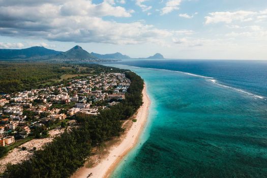On the beautiful beach of the island of Mauritius along the coast. Shooting from a bird's eye view of the island of Mauritius