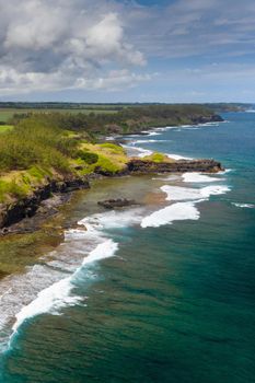 View of the famous Golden beach between black volcanic rocks on the banks of the Gris-Gris river,La Roche qui pleure in Mauritius.