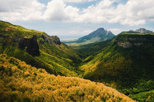 Mountain Landscape of the gorge on the island of Mauritius, Green mountains of the jungle of Mauritius.