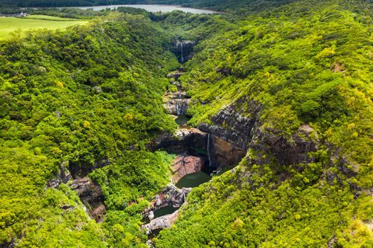 Aerial view from above of the Tamarin waterfall seven cascades in the tropical jungles of the island of Mauritius.