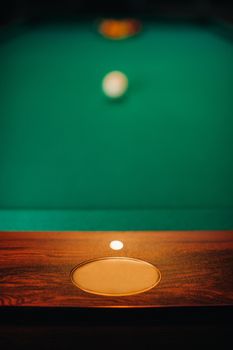 sideboard with a sign for the inscription of a green-coated billiard table.