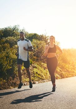 Just keep running. a fit young couple going for a run outdoors