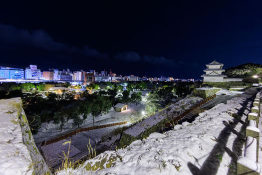 Akashi Castle and city skyline on snowy winter night. High quality photo