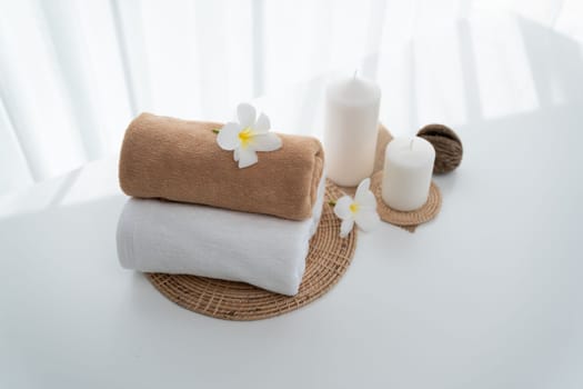 Spa accessory composition set in day spa hotel , beauty wellness center . Spa product are placed in luxury spa resort room , ready for massage therapy from professional service .