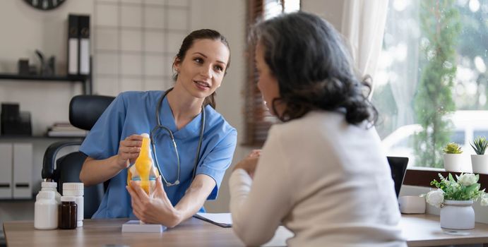 Doctor explain about back bone issue to fat woman patient. Health care and healthy lifestyle concept...