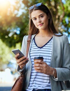 Communication is key in business. Cropped portrait of an attractive young woman using her cellphone while commuting to work