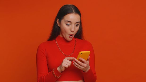 Happy excited joyful woman use smartphone typing browsing shouting say wow yes found out great big win, good news, lottery jackpot goal achievemen, game victory, celebrating success, winning, like
