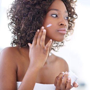 Restoring your skin, changing your life. a beautiful young woman during her daily beauty routine