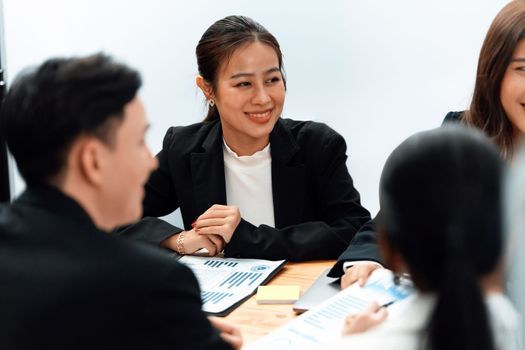 Business team of financial data analysis meeting with business intelligence, report paper and dashboard on laptop for marketing strategy. Business people working together to promote harmony in office.