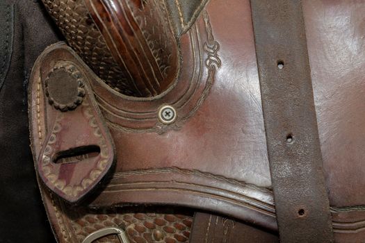 Leather horse saddle design close up background texture. Brown cowboy design beauty