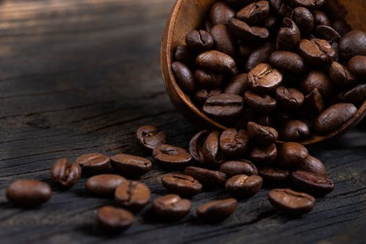 coffee beans with wooden spoon , isolated