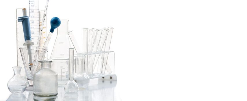 Group of scientific laboratory glassware with clear liquid solution, Science research and development concept.