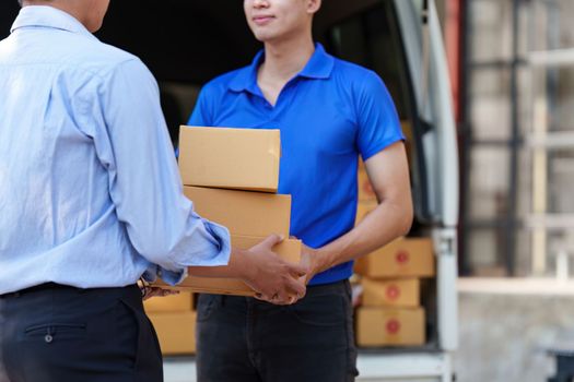 Asian Man hand accepting a delivery boxes. delivery logistic concept.