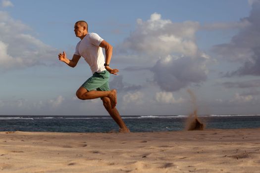 man doing sports on the beach. bali