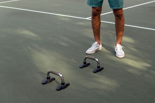 man doing push-ups on the court. bali