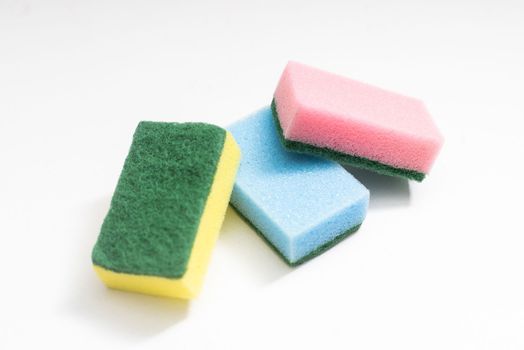 Kitchen dishcloth, cleanup concept, housework. Colorful kitchen sponges for cleaning close-up, housekeeping