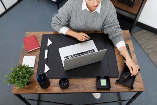 woman working at office desk top view.