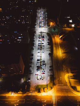 Night life, light up street, street lights shining in the middle of the night. Aerial view.